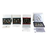 A collection of four UK Royal Mint issue proof sets, comprising 1992, 1997, 1999, and 2000, in