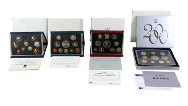 A collection of four UK Royal Mint issue proof sets, comprising 1992, 1997, 1999, and 2000, in