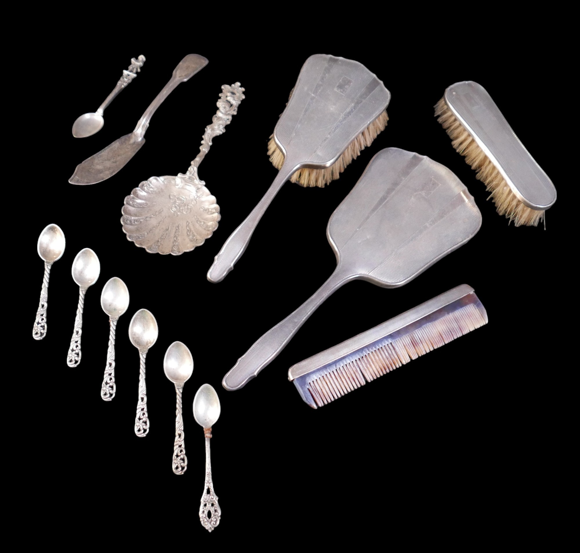 A silver back four piece dressing table set, together with some continental silver flatware, and a