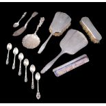A silver back four piece dressing table set, together with some continental silver flatware, and a