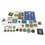 A small collection of British and foreign coins, including a United States one dollar coin, in