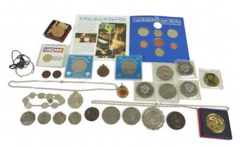 A small collection of British and foreign coins, including a United States one dollar coin, in