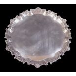 An Elizabeth ll silver salver with cast applied scroll and shell border, C.G.V. Ltd., London 1969/