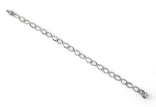 An 18ct white gold diamond bracelet, 18.5cm long, 6mm wide, 11.8grams. Good condition, diamonds