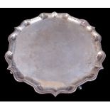 A Garrard & Co Ltd silver tray, on four pad feet with shaped pie crust edge, Sheffield 1967, 36cm