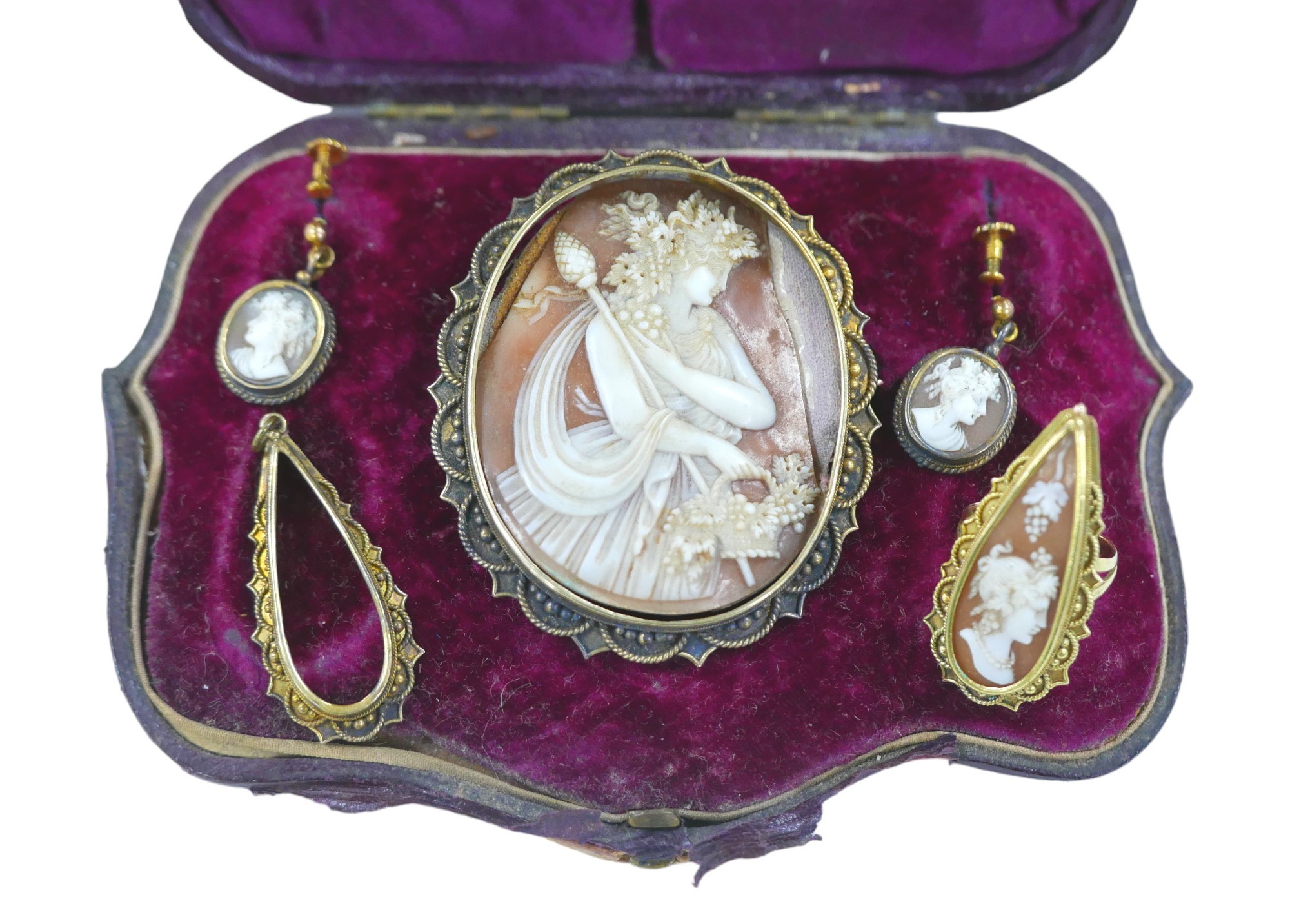 A demi-parure of Victorian gold and yellow metal mounted cameo jewellery, comprising a 9ct gold