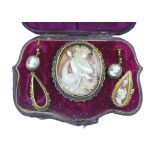 A demi-parure of Victorian gold and yellow metal mounted cameo jewellery, comprising a 9ct gold