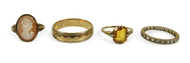 A group of gold rings, comprising a cameo ring, size N, surface test above 9ct gold, a 9ct gold