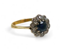 An 18ct yellow gold sapphire and diamond ring, size O, 2.8 g, head size 10 by 5mm.