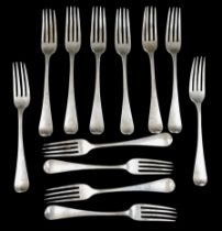 A group of twelve George IV silver dinner forks, IWB (?), London 1826, each with engraved stags head