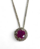 A 9ct white gold thin chain, marked 375, together with a circular diamond set pendant with pink