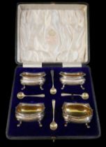 A boxed set of four George Vl silver salts with spoons, Elkington and co, Birmingham 1938/39, weight