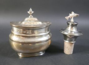 A George V silver tea caddy, Sheffield 1925/26, and a silver spirit stopper with salmon finial,