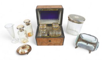 A 19th century satinwood box with four glass stoppered bottles within, star gilt design, plus oval