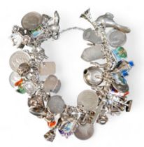 A silver charm bracelet with multiple charms