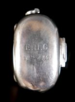 An Edward VII silver twin sovereign holder, of rounded lozenge form with hinged cover, hinged catch,