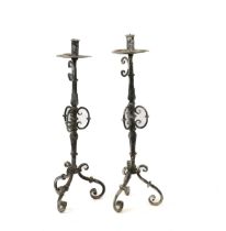 A PAIR OF REGENCE STYLE LEAD ALLOY METAL FLOOR STANDING CANDLESTICKS (2)