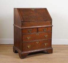 AN EARLY 18TH CENTURY OAK FOUR DRAWER BUREAU