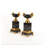 A PAIR OF GILT AND PATINATED METAL ORNAMENTAL TAZZE (2)