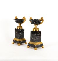 A PAIR OF GILT AND PATINATED METAL ORNAMENTAL TAZZE (2)