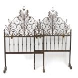 A PAIR OF WROUGHT IRON BED HEADBOARDS OR SCREENS (2)