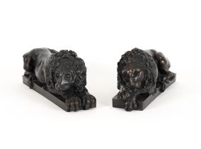 A PAIR OF PATINATED BRONZE RECUMBENT LIONS AFTER CANOVA (2)