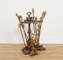 A VICTORIAN BRASS LEAD WEIGHTED DOOR STOP; TOGETHER WITH A CAST-IRON STICK STAND AND THREE...