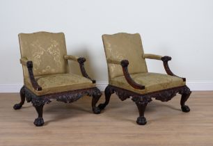 A PAIR OF GEORGE II STYLE CARVED MAHOGANY OPEN ARMCHAIRS (2)
