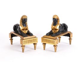 A PAIR OF EMPIRE STYLE GILT AND BRONZE PATINATED EGYPTIAN SPHINXES (2)