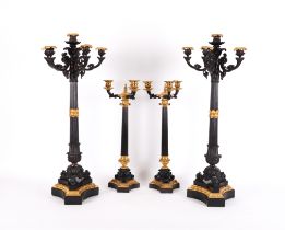 TWO PAIRS OF FRENCH RESTAURATION STYLE GILT AND BRONZE PATINATED CANDLABRA (4)