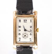 A 9CT GOLD CURVED RECTANGULAR CASED WRISTWATCH