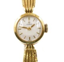 A TISSOT GOLD CIRCULAR CASED LADY'S WRISTWATCH