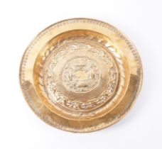 A GERMAN NUREMBERG BRASS ALMS DISH