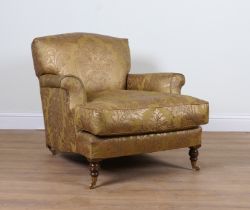 A HOWARD STYLE FLORAL PATTERNED, GOLD UPHOLSTERED EASY ARMCHAIR