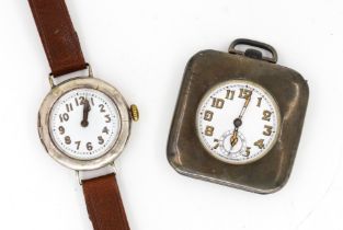 A SILVER TRAVELLING CLOCK AND A SILVER CASED WRISTWATCH (2)