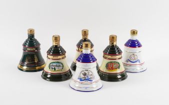 A COLLECTION OF BELLS WHISKY DECANTERS INCLUDING COMMEMORATING THE BIRTH OF PRINCESS BEATRICE ...