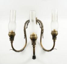 A SET OF NINE PATINATED GILT-BRASS THREE LIGHT WALL LIGHTS (9)