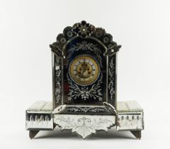 AN ETCHED MIRRORED GLASS MANTEL CLOCK