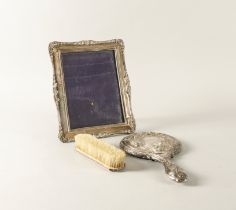 A SILVER MOUNTED SHAPED RECTANGULAR PHOTOGRAPH FRAME AND TWO FURTHER ITEMS (3)