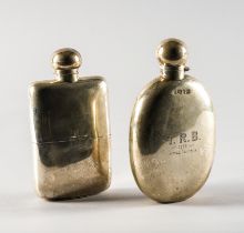 A LATE VICTORIAN SILVER OVAL SPIRIT FLASK AND ANOTHER SILVER SPIRIT FLASK (2)