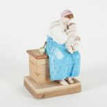 A RUSSIAN BISCUIT PORCELAIN FIGURE OF MOTHER AND CHILD
