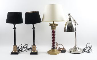 A PAIR OF BLACK LACQUERED AND BRASS FINISHED COLUMN TABLE LAMPS (4)