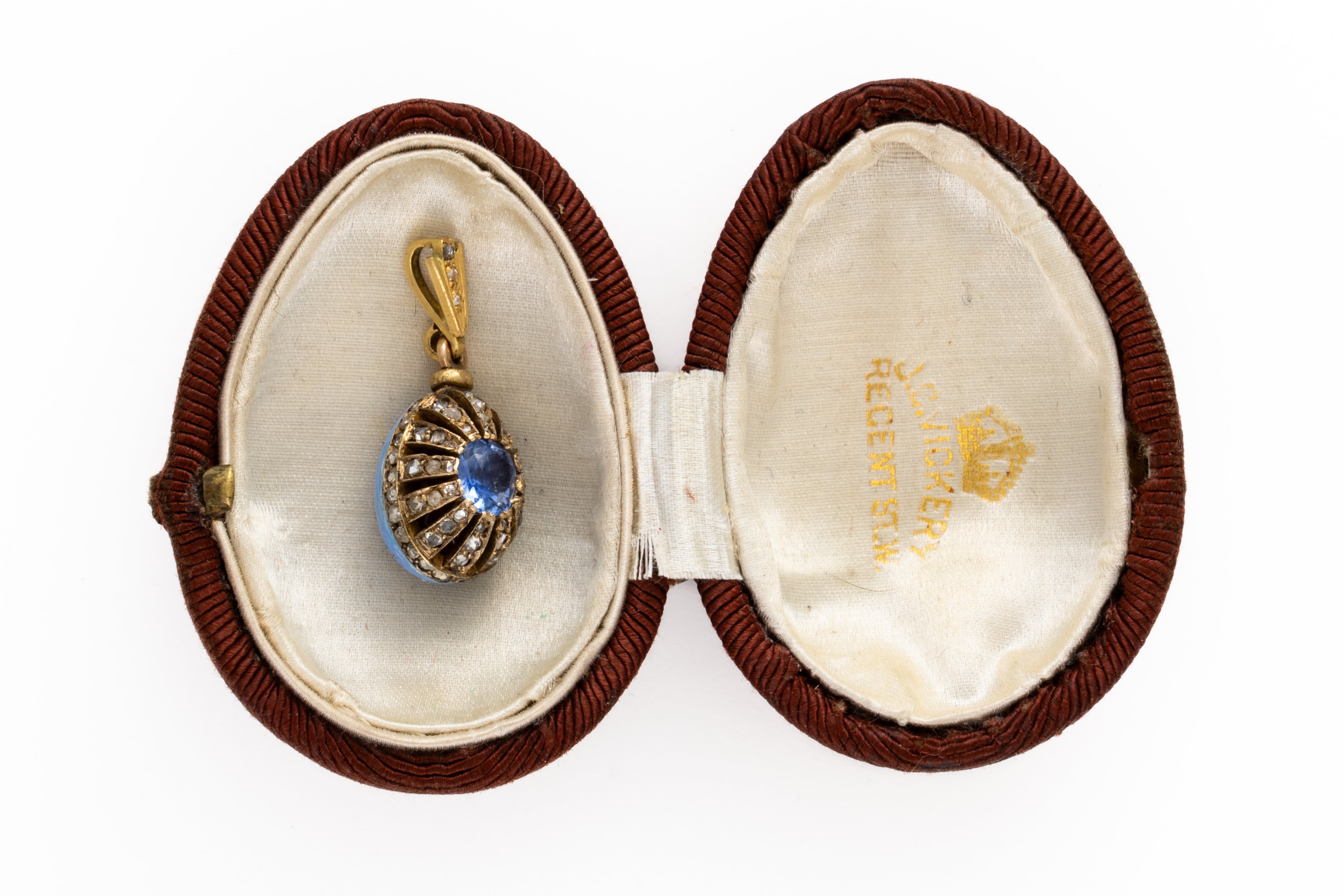 A SAPPHIRE, DIAMOND AND ENAMEL EGG CHARM