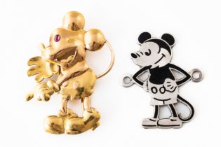 A GOLD MICKEY MOUSE BROOCH AND A SILVER AND ENAMEL MICKEY MOUSE BADGE (2)