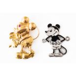 A GOLD MICKEY MOUSE BROOCH AND A SILVER AND ENAMEL MICKEY MOUSE BADGE (2)