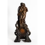 AN AUSTRIAN ART NOUVEAU CERAMIC FIGURAL MANTEL CLOCK