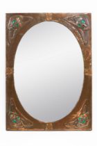 IN THE MANNER OF LIBERTY & CO; AN ARTS & CRAFTS COPPER FRAMED WALL MIRROR