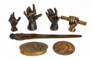 A GROUP OF BRONZE MODELS OF HANDS AND OTHER ITEMS (7)