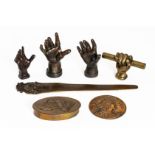 A GROUP OF BRONZE MODELS OF HANDS AND OTHER ITEMS (7)