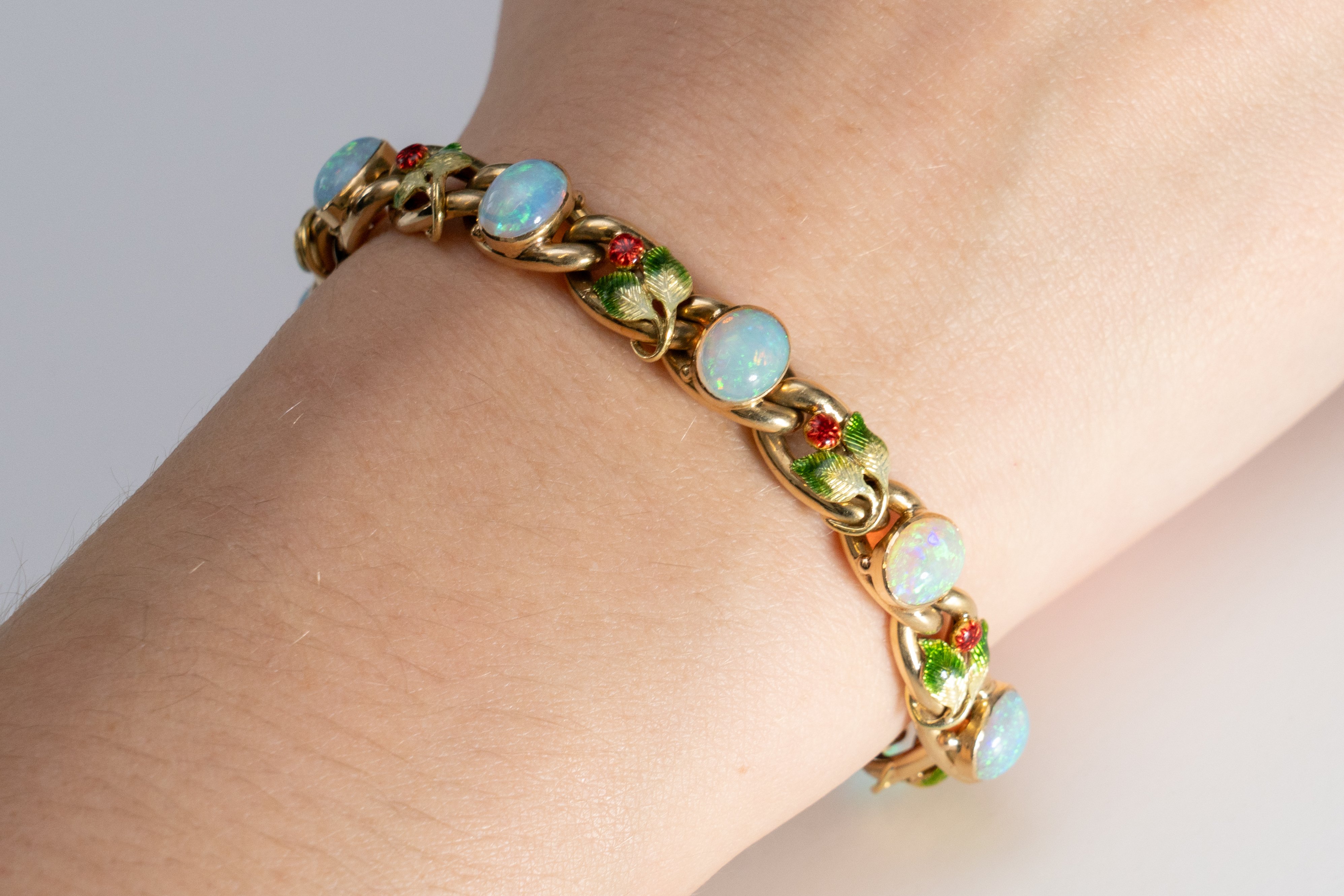 ATTRIBUTED TO MRS NEWMAN: A GOLD, OPAL AND ENAMEL BRACELET - Image 2 of 7